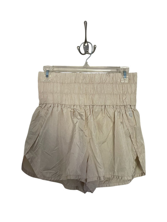 Beige Free People athletic shorts.