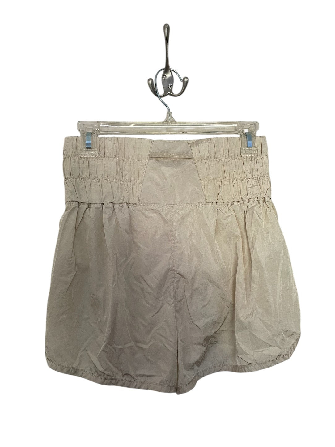 Beige Free People athletic shorts.