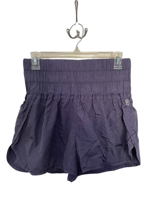 Purple Free People athletic shorts.