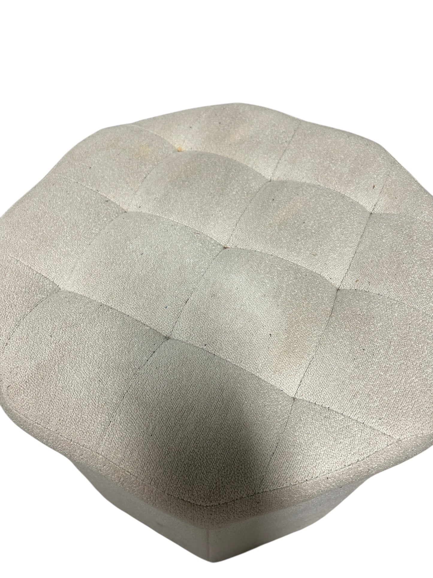 Light gray upholstered ottoman with storage.