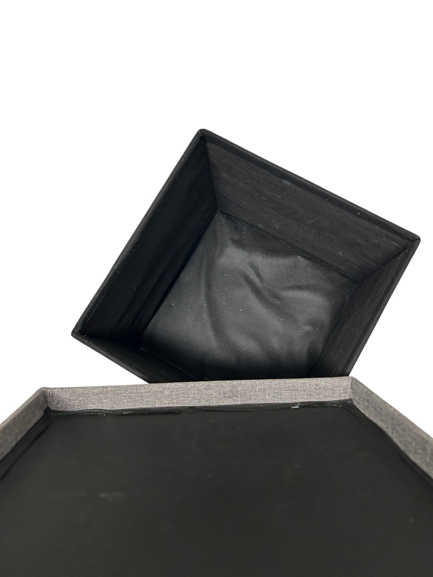 Dark gray, square storage ottoman.