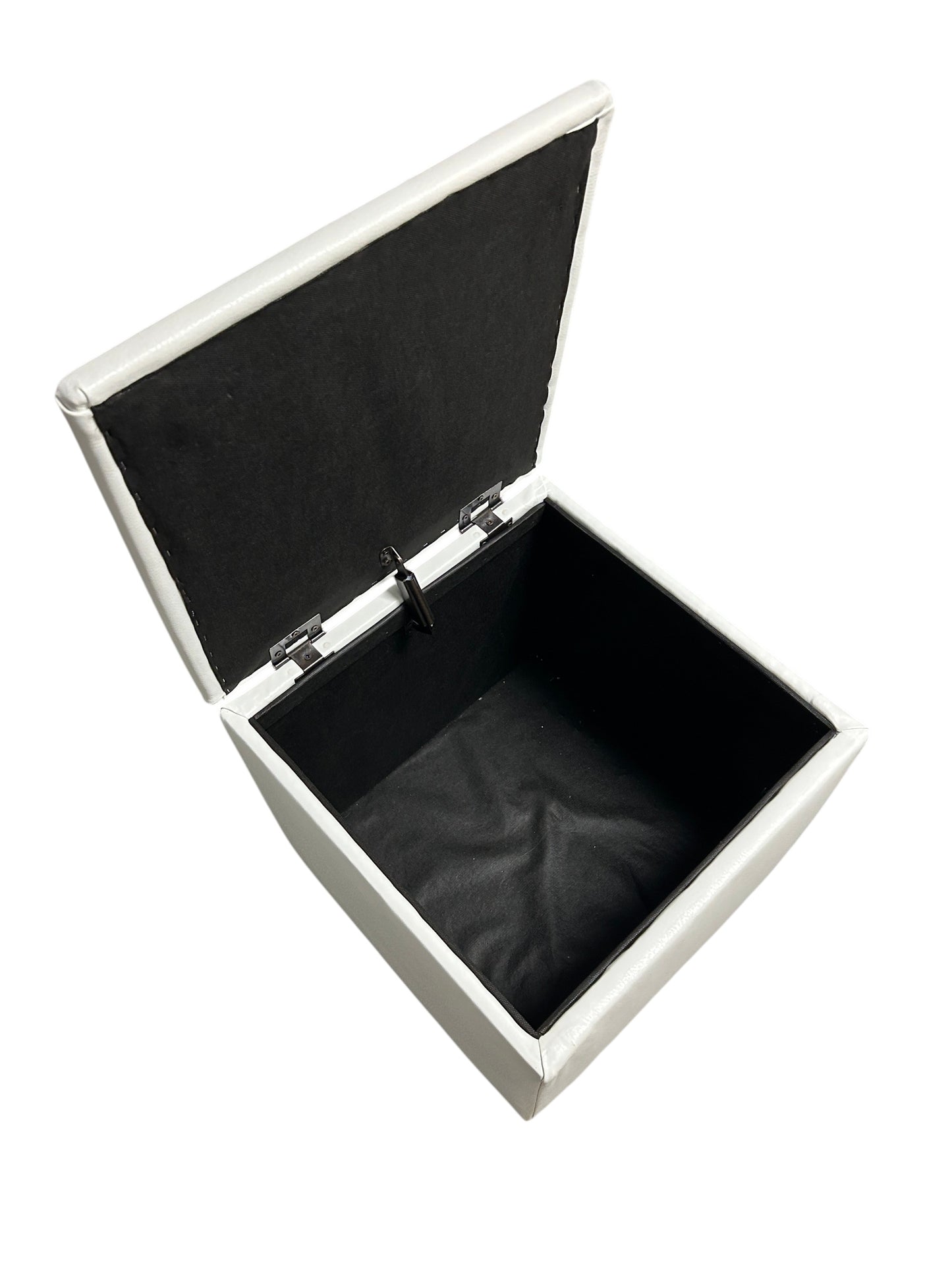 White faux leather square storage ottoman.