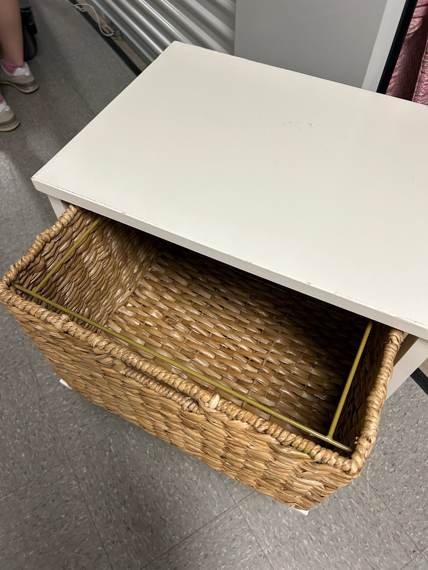 White 2 tier wooden storage unit with woven natural baskets.