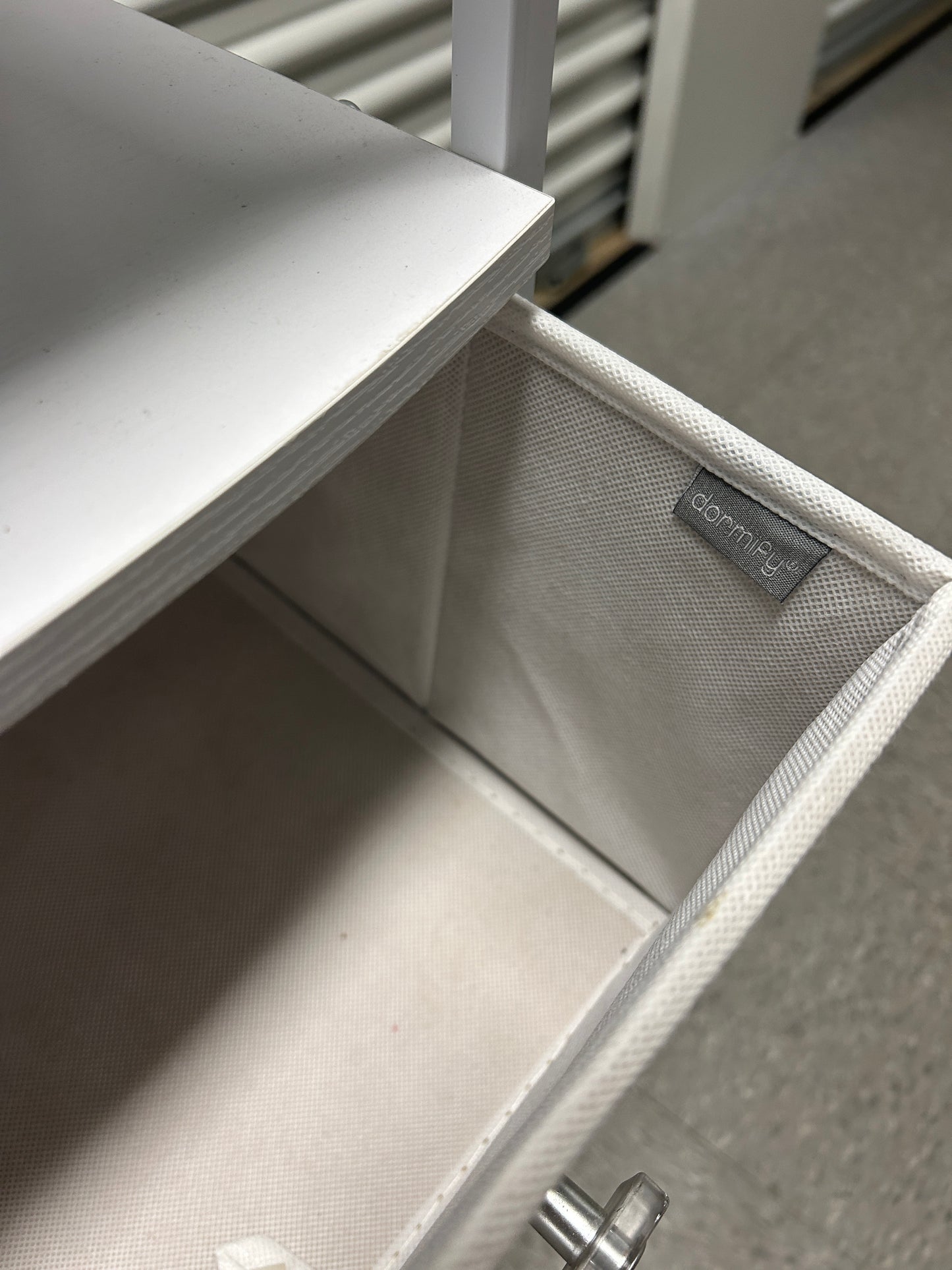 Dormify white nightstand with 3 drawers and power outlets.
