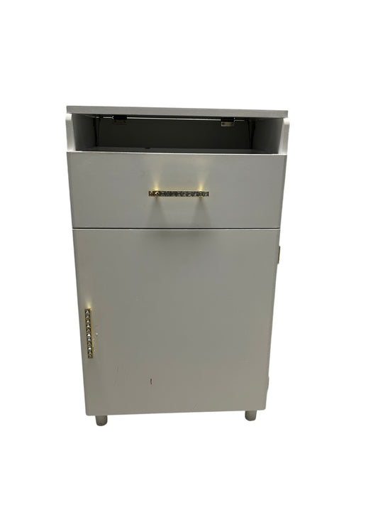White vanity cabinet with built-in lights and mirror.