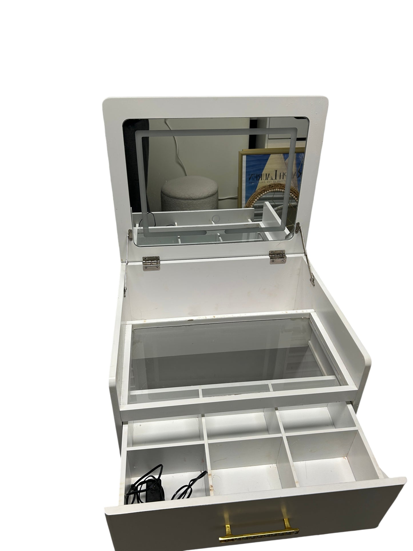 White vanity cabinet with built-in lights and mirror.