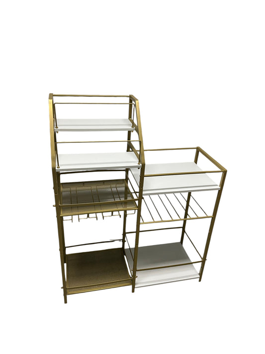 Gold and white bar cart with multiple shelving units.