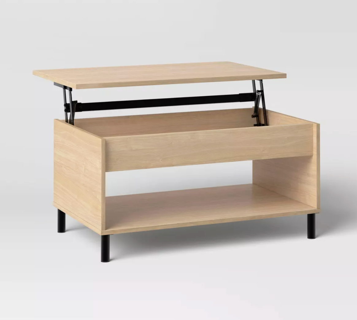 Target wooden coffee table with lift top and storage.