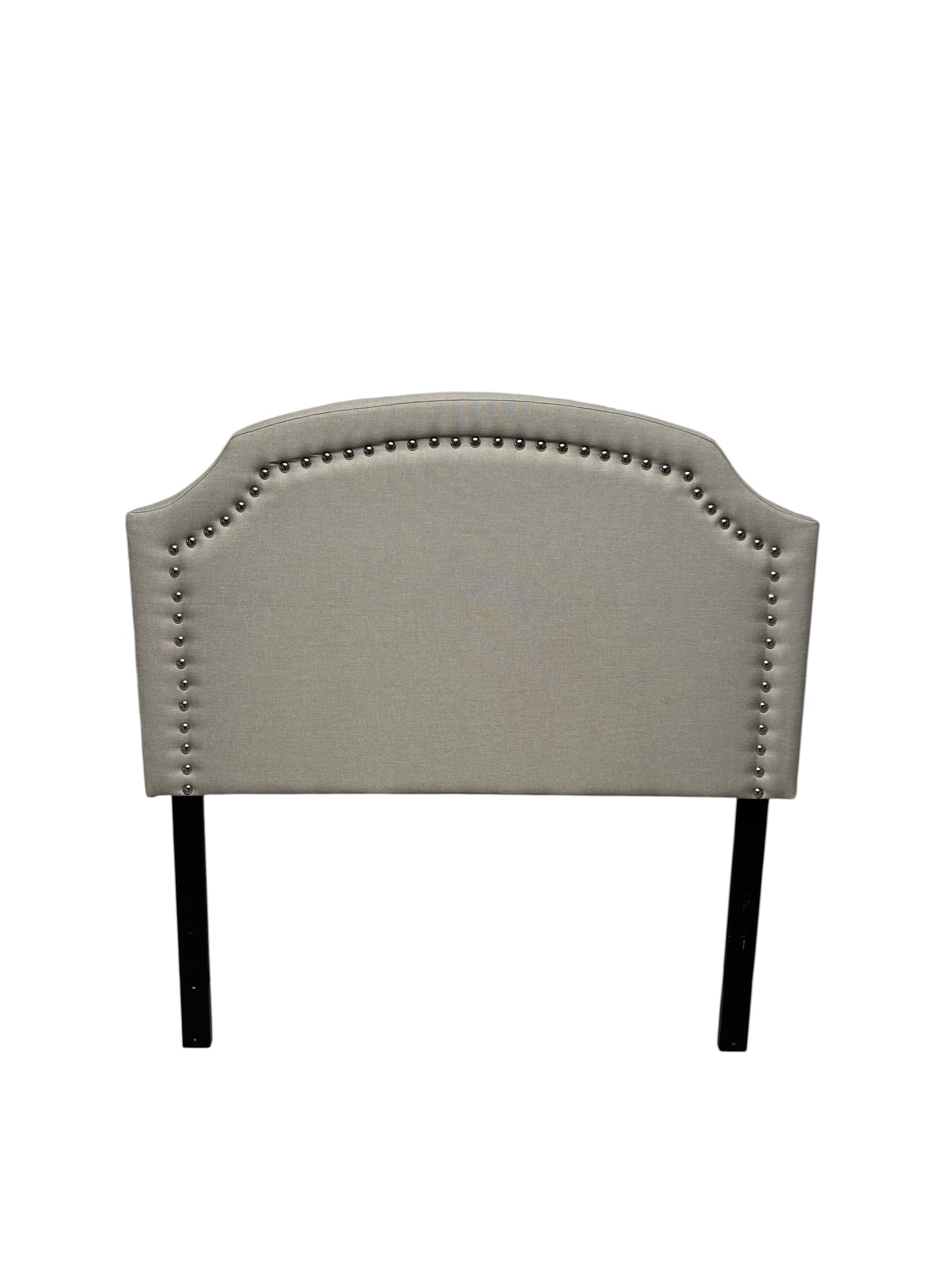Gray twin headboard with silver buttons and black legs.