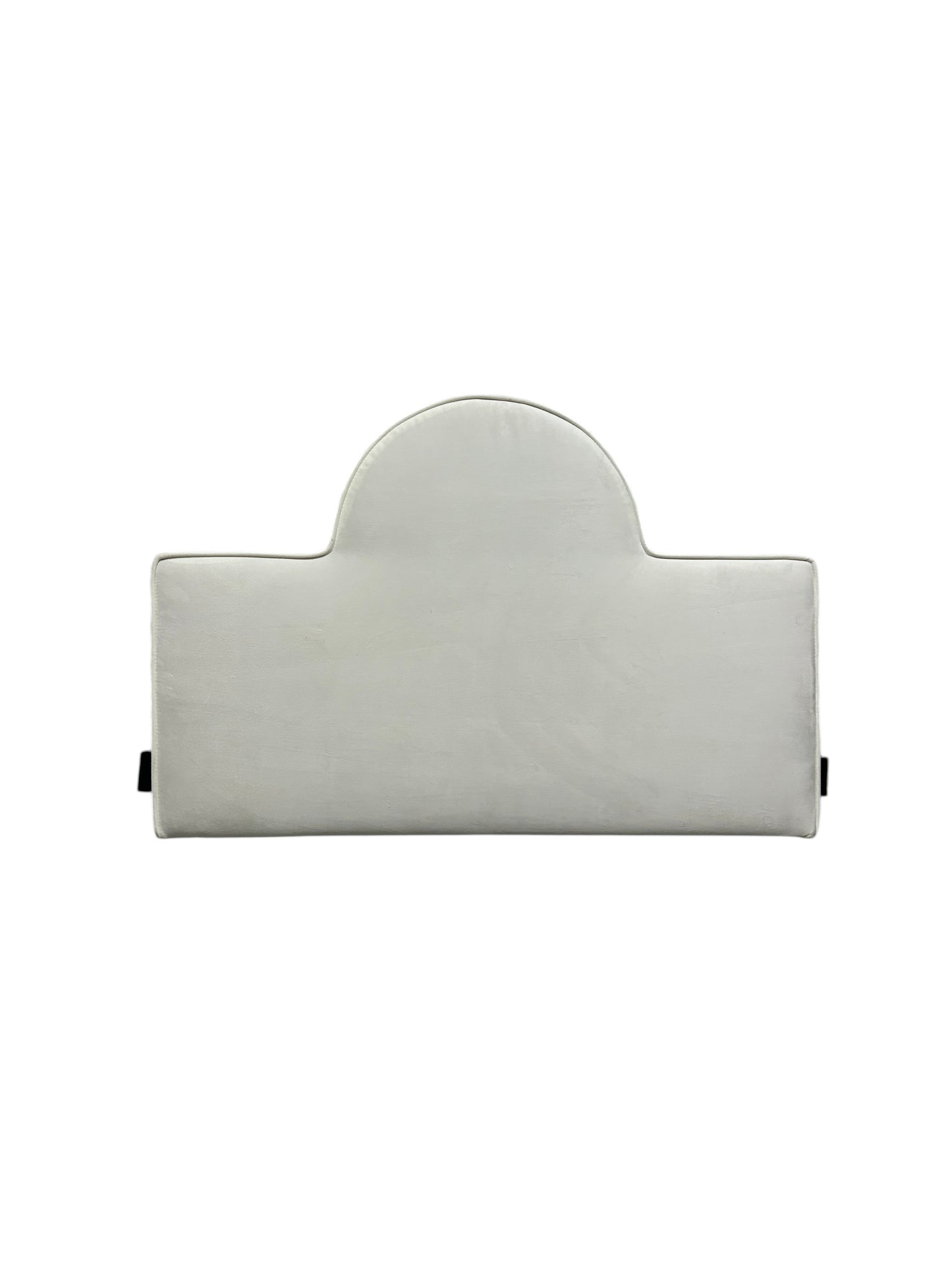 White velvet twin headboard with black legs.