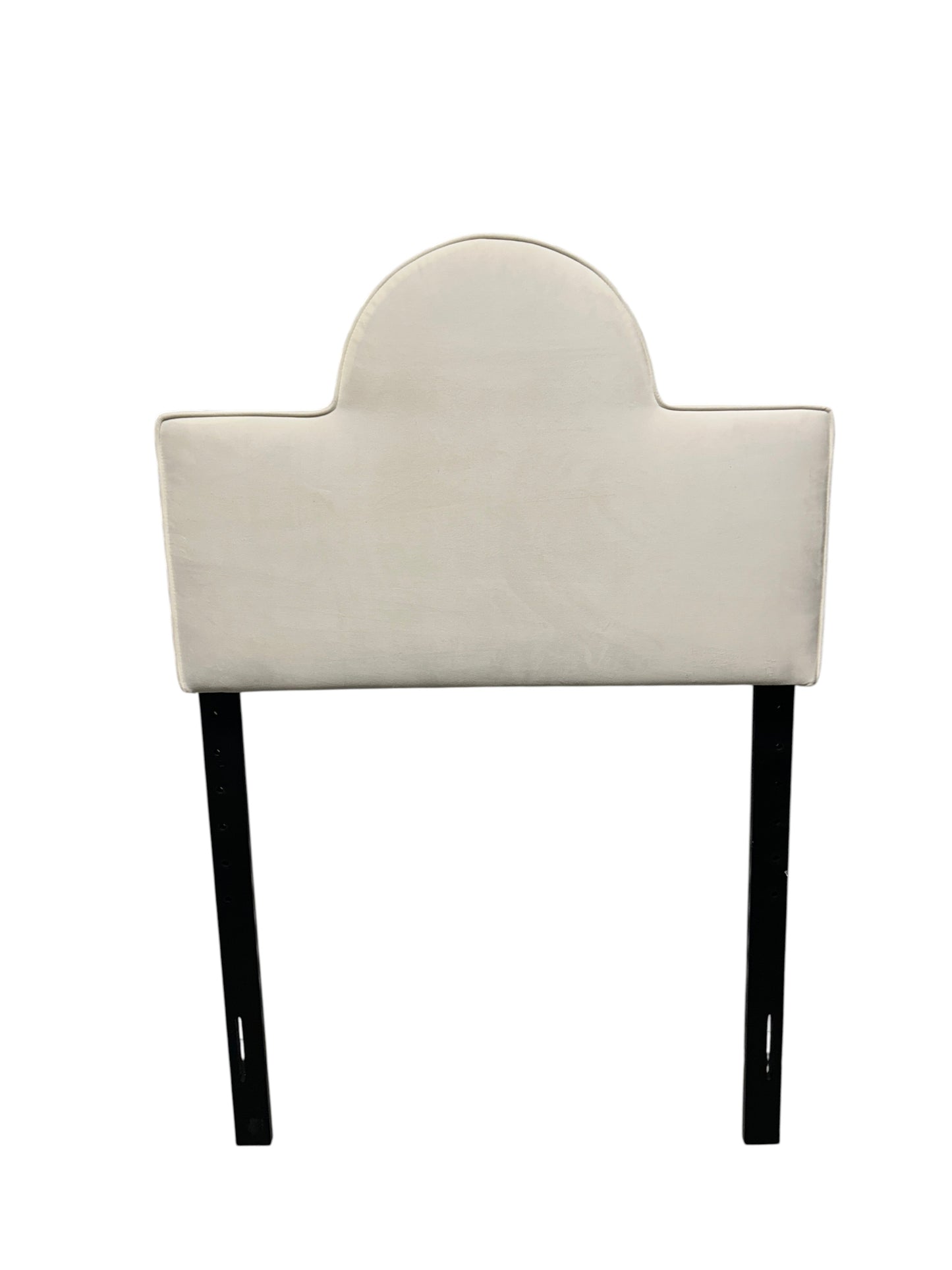 White velvet twin headboard with black legs.