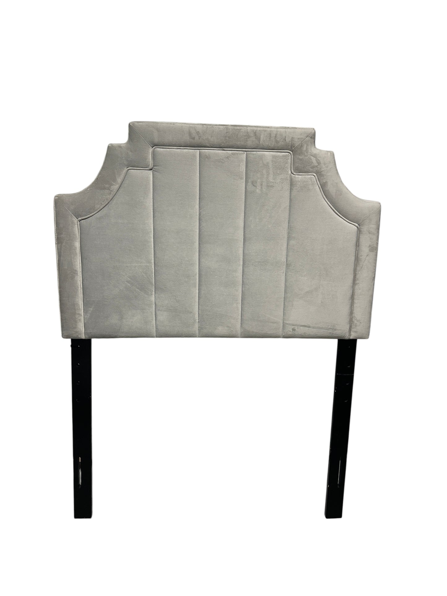 Gray velvet twin headboard with black legs.