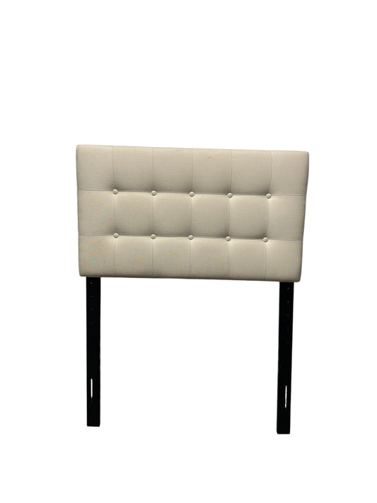 Cream twin headboard with black legs.