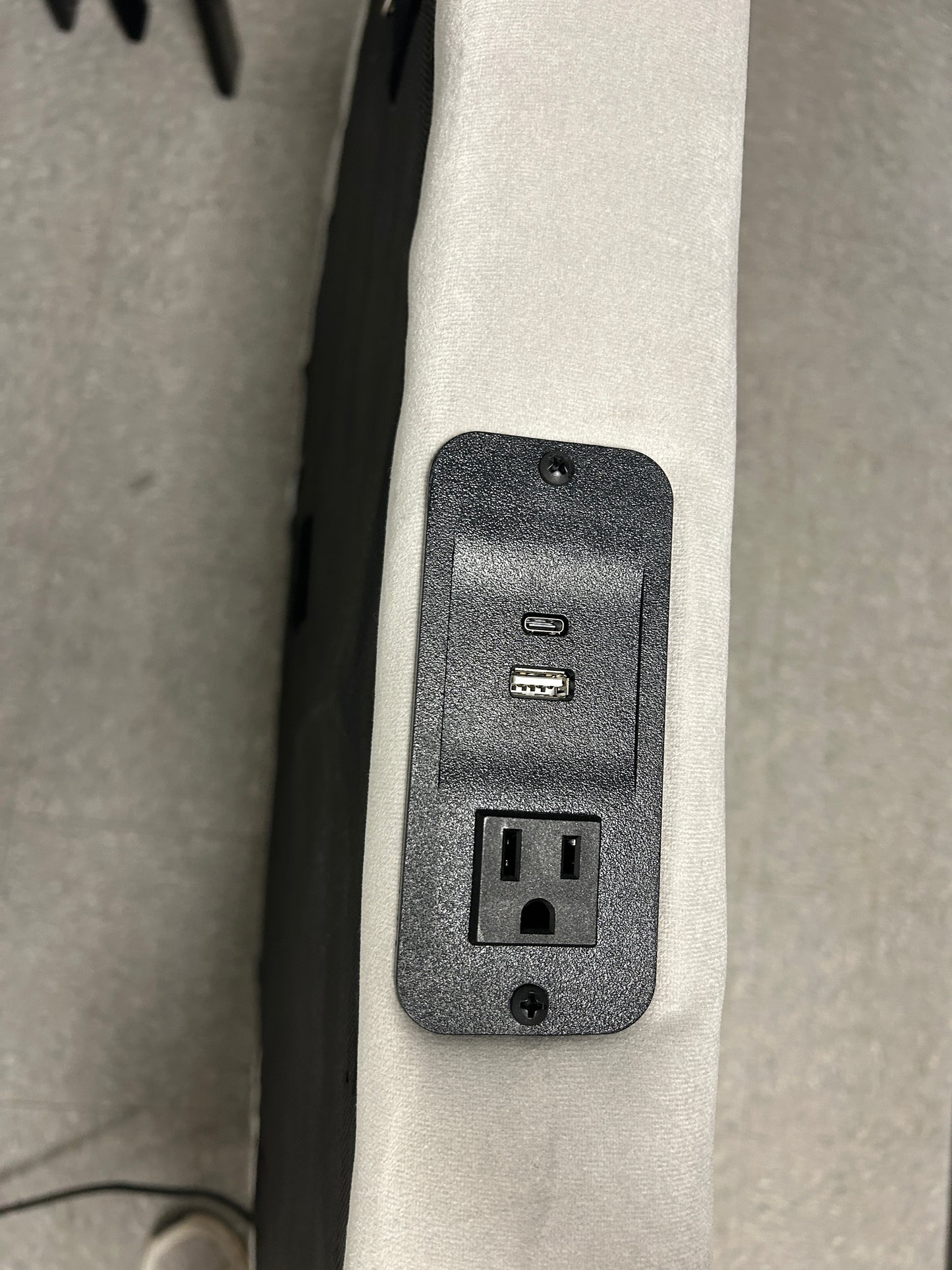 Gray velvet twin headboard with charging port.