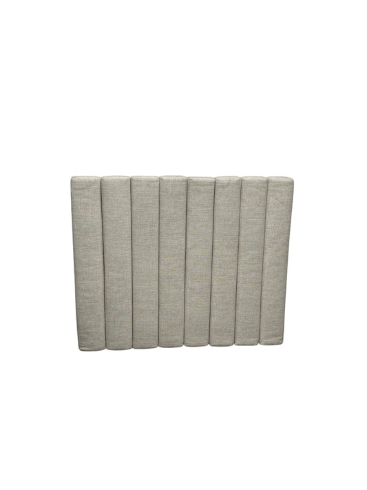 Beige yarn twin headboard.
