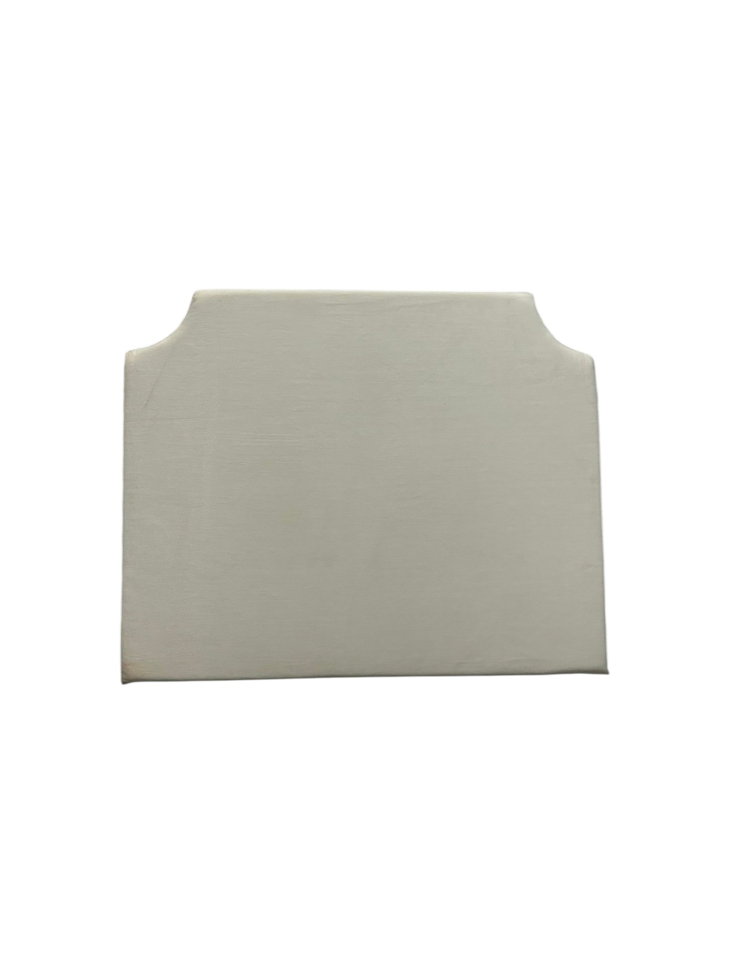 Cream velvet twin headboard with curved notched corners.