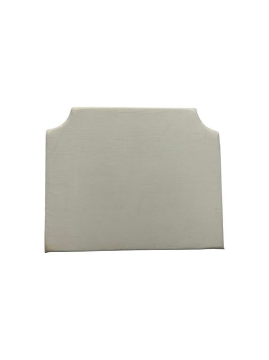 Cream velvet twin headboard with curved notched corners.