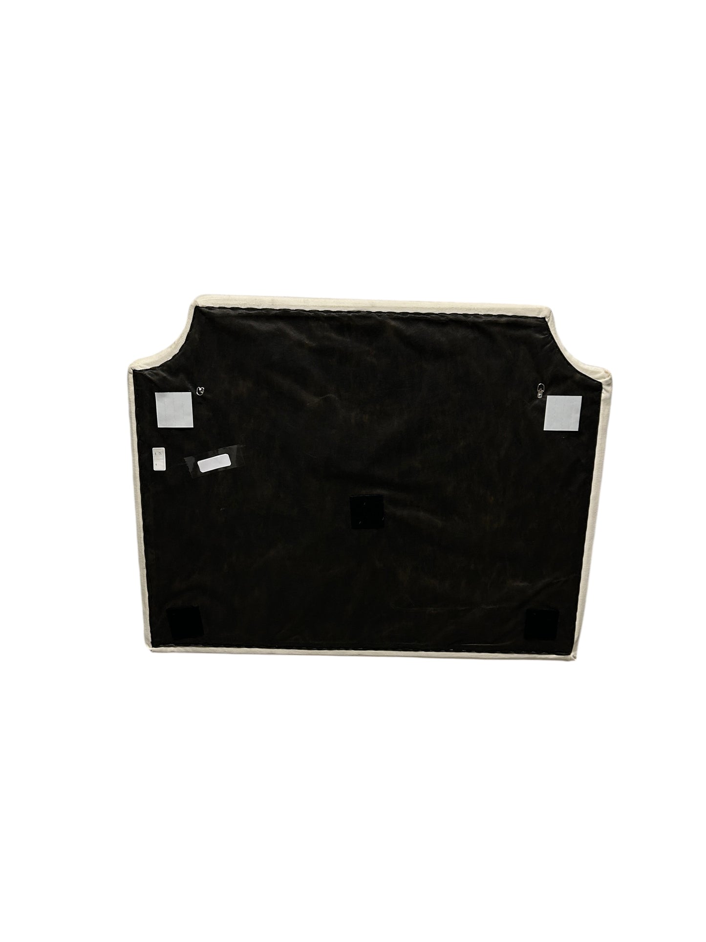 Cream velvet twin headboard with curved notched corners.