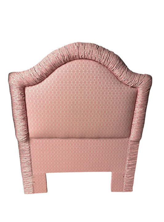 Custom-built pink and white patterned twin headboard.