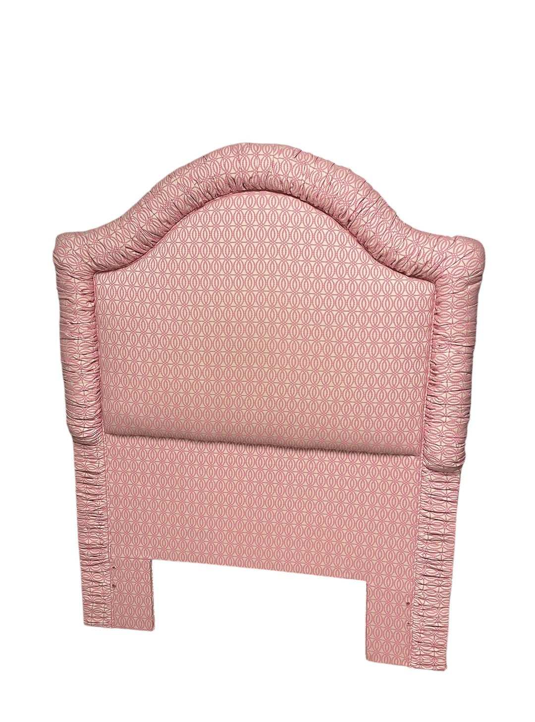 Custom-built pink and white patterned twin headboard.