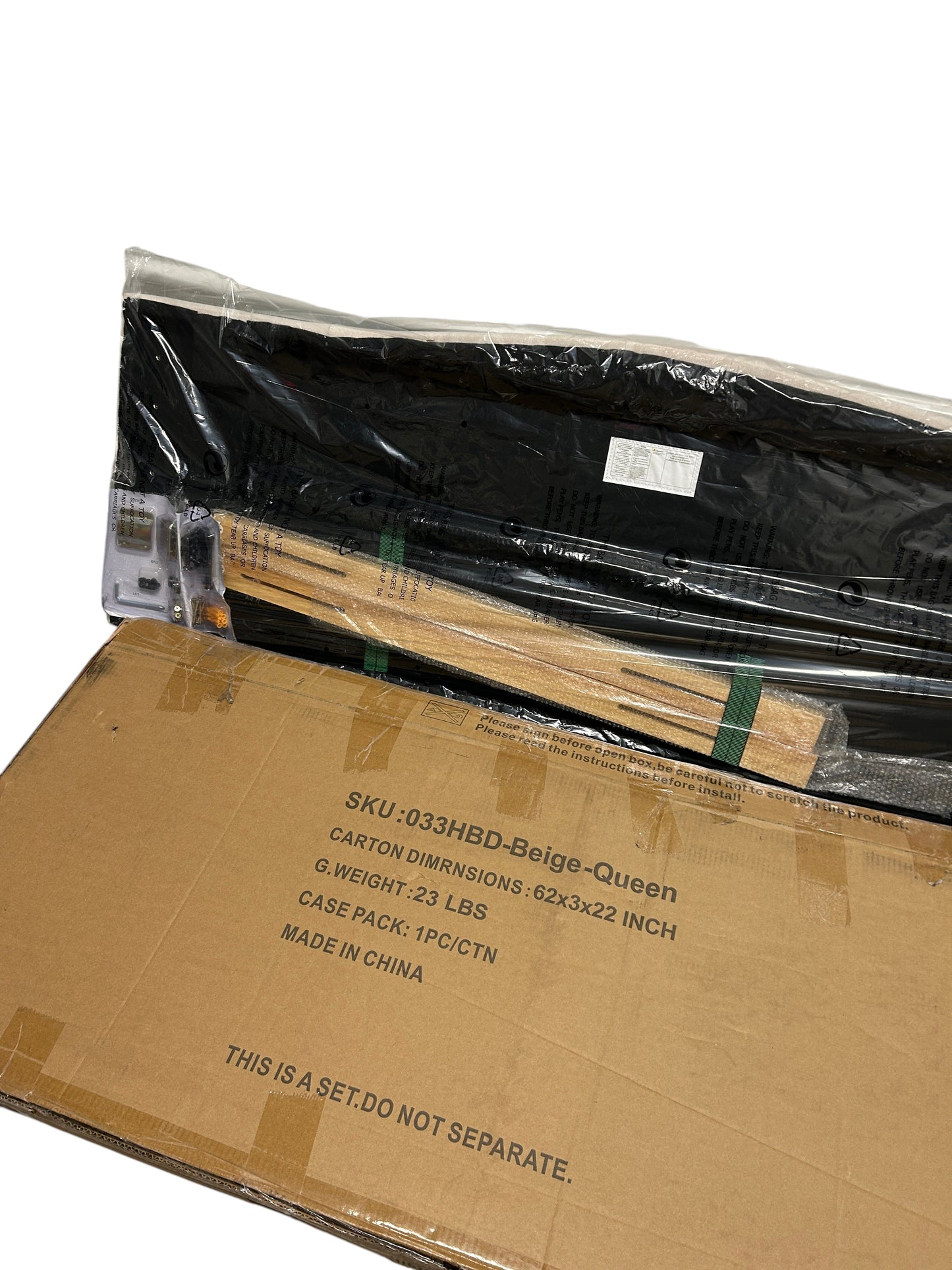 Brand new, still in the box beige queen headboard with wooden legs.