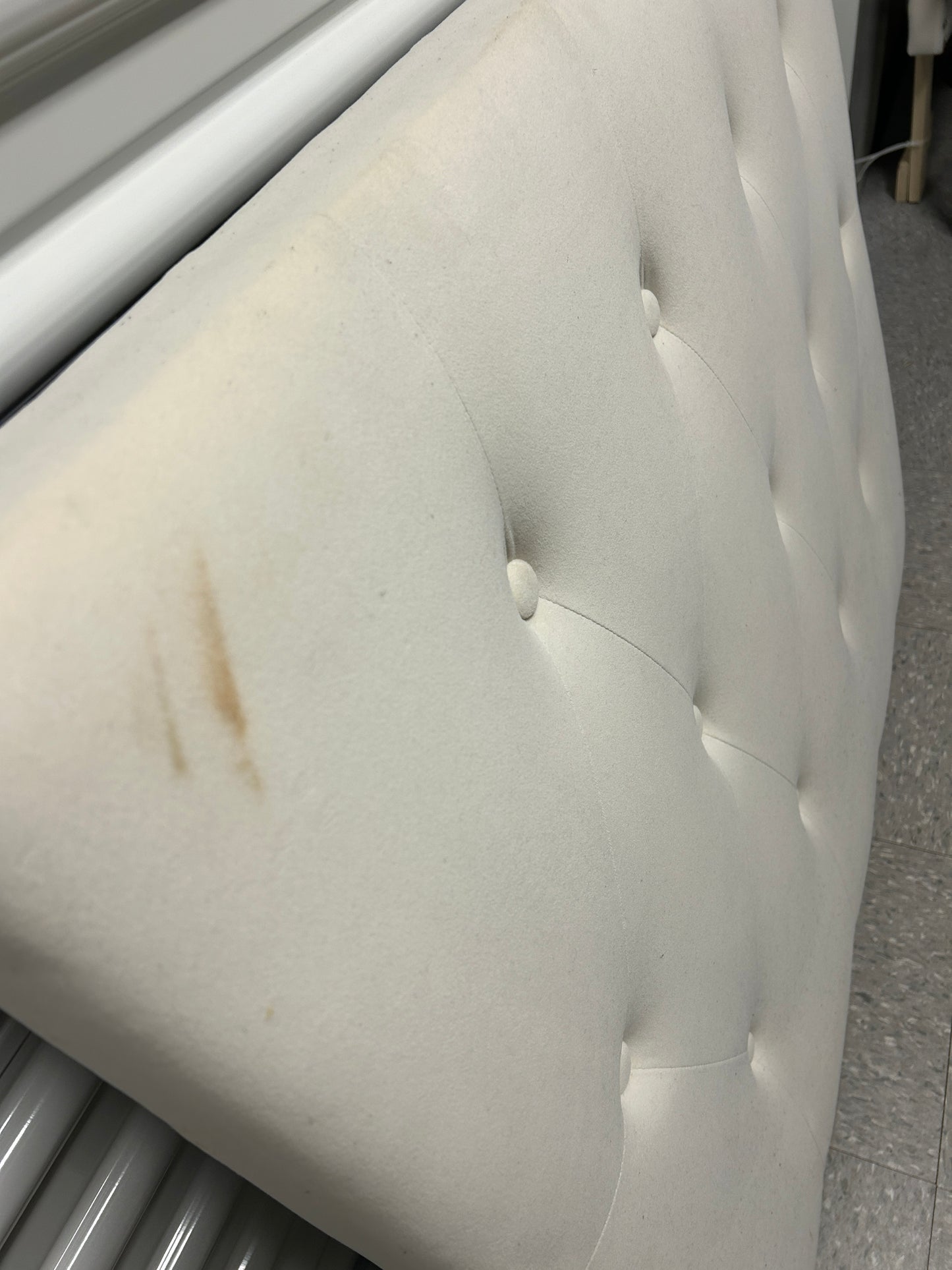 Cream velvet twin headboard with charging port.