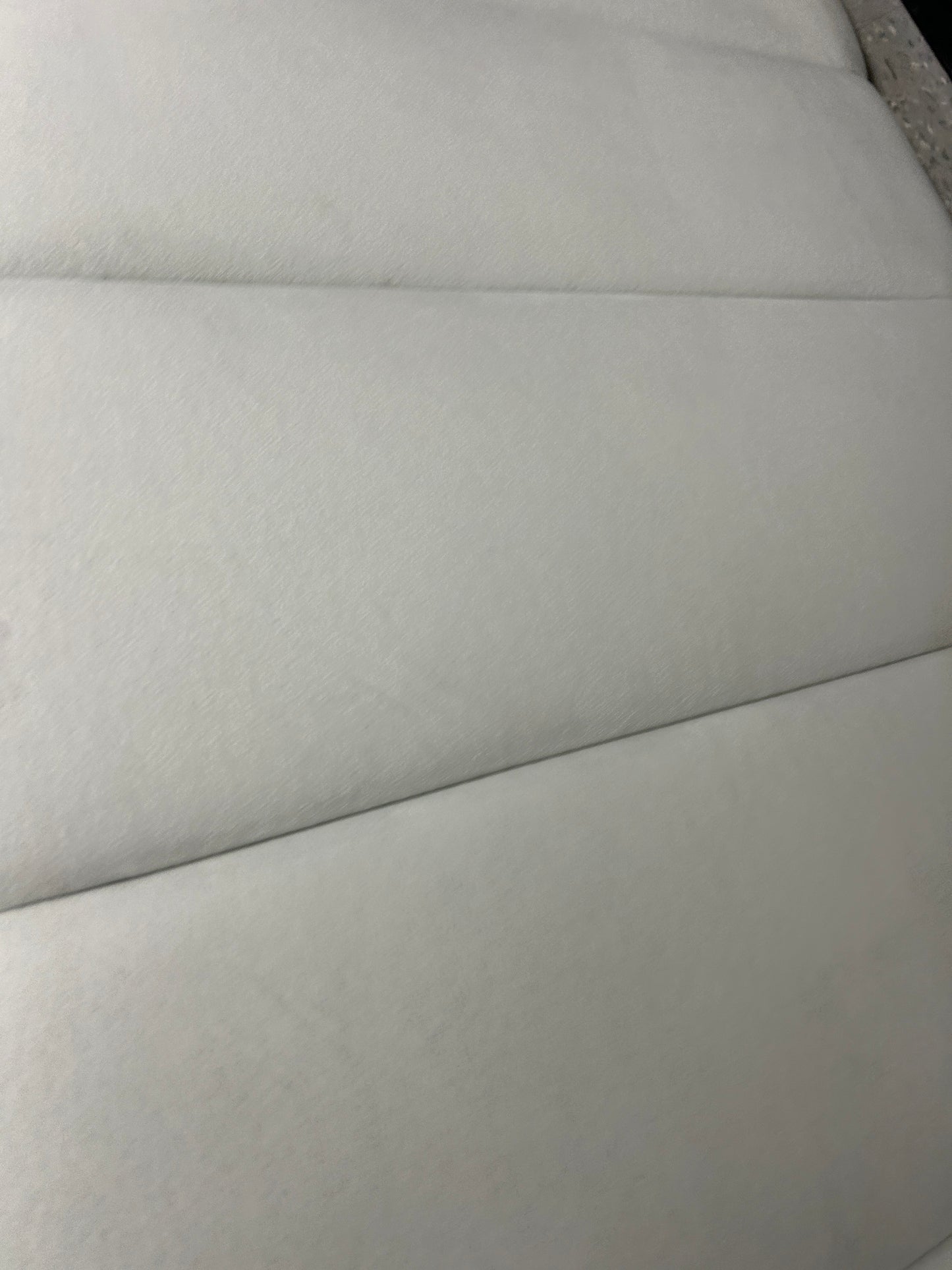 Cream velvet twin headboard.