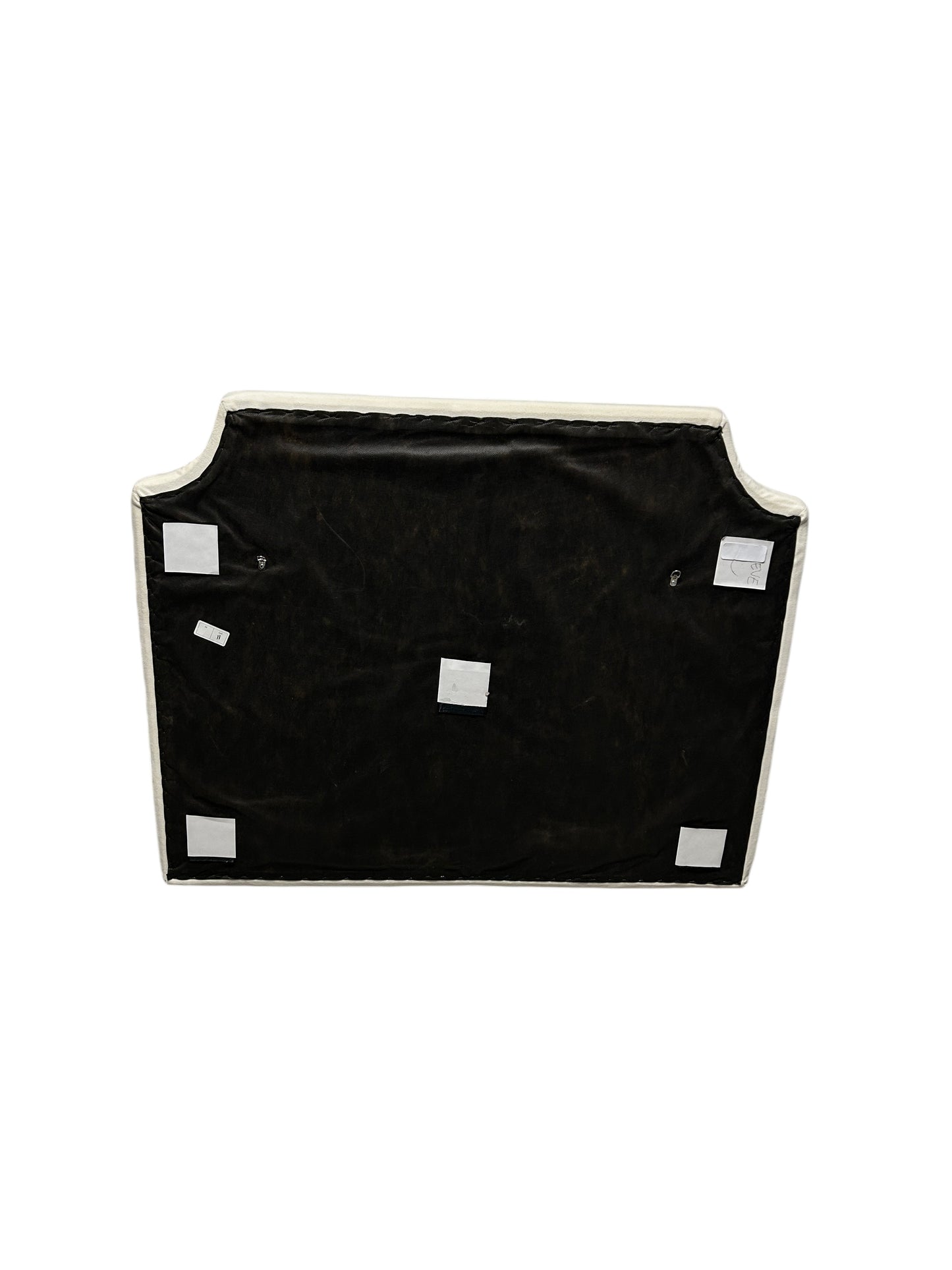 Cream velvet twin headboard with curved notched corners.