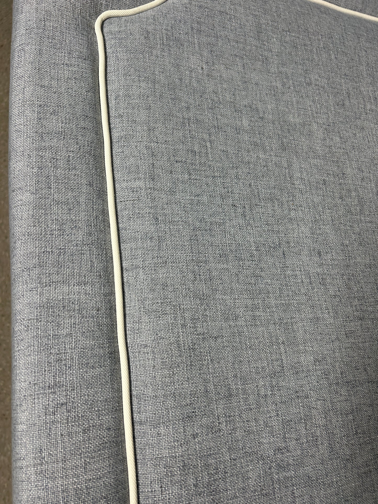 Pottery Barn Teen blue twin headboard with white piping and charging port.