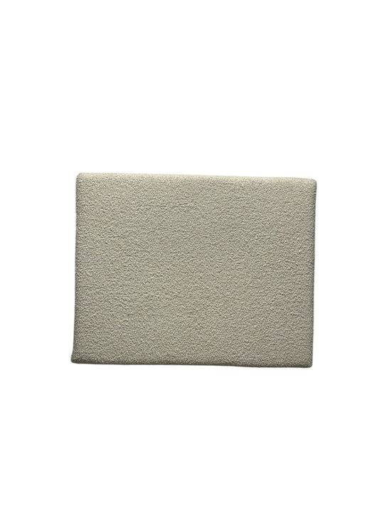 Cream twin headboard with yarn fabric and charging outlet.