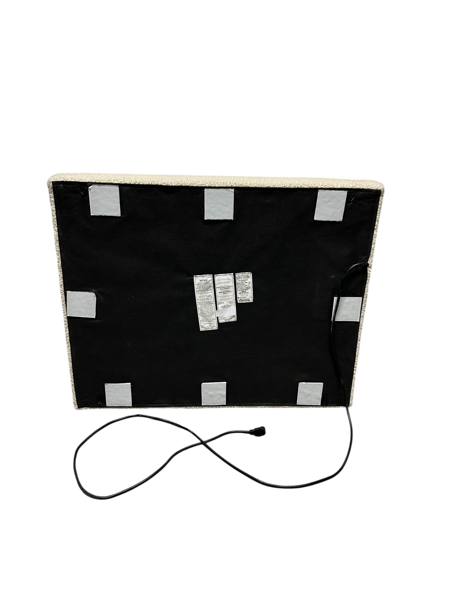 Cream twin headboard with yarn fabric and charging outlet.