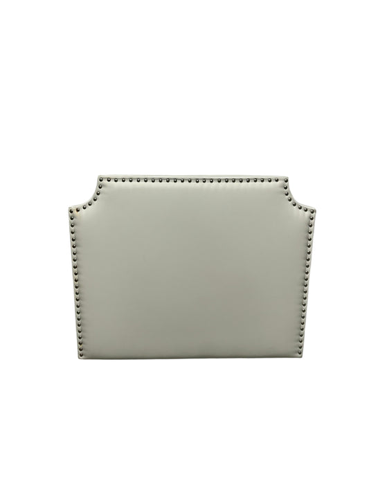 White twin headboard with silver buttons and a charging outlet.