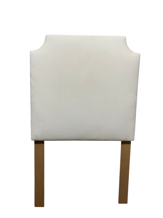 Dorm Decor white twin headboard with wooden legs.
