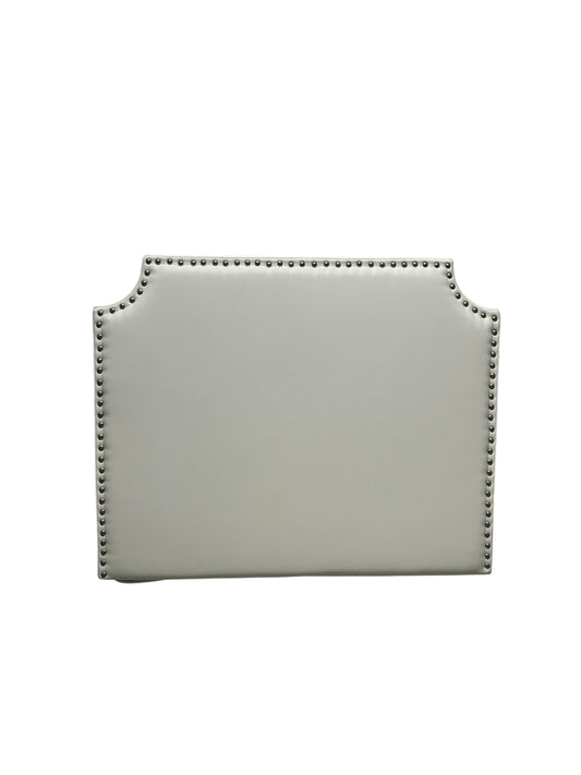 White twin headboard with silver buttons and a charging outlet.
