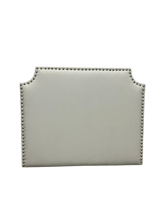 White twin headboard with silver buttons and a charging outlet.