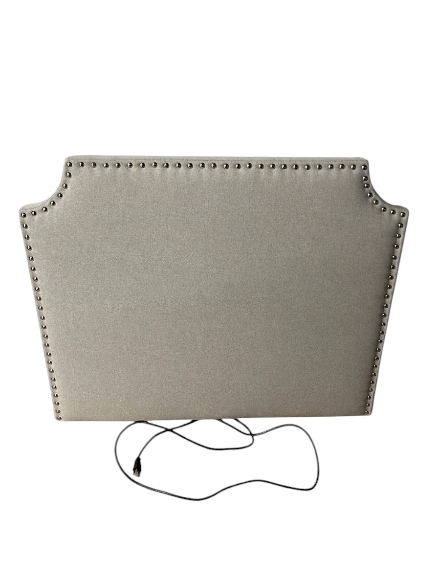 Gray twin headboard with silver buttons and a charging outlet.