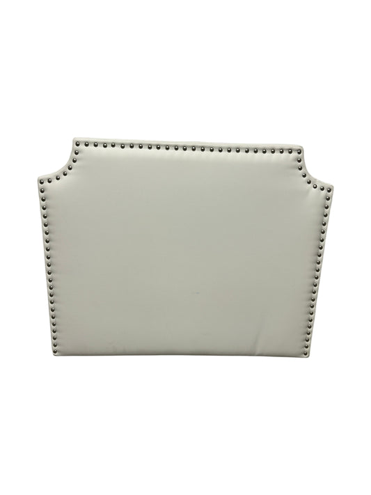 White twin headboard with silver buttons and a charging outlet.