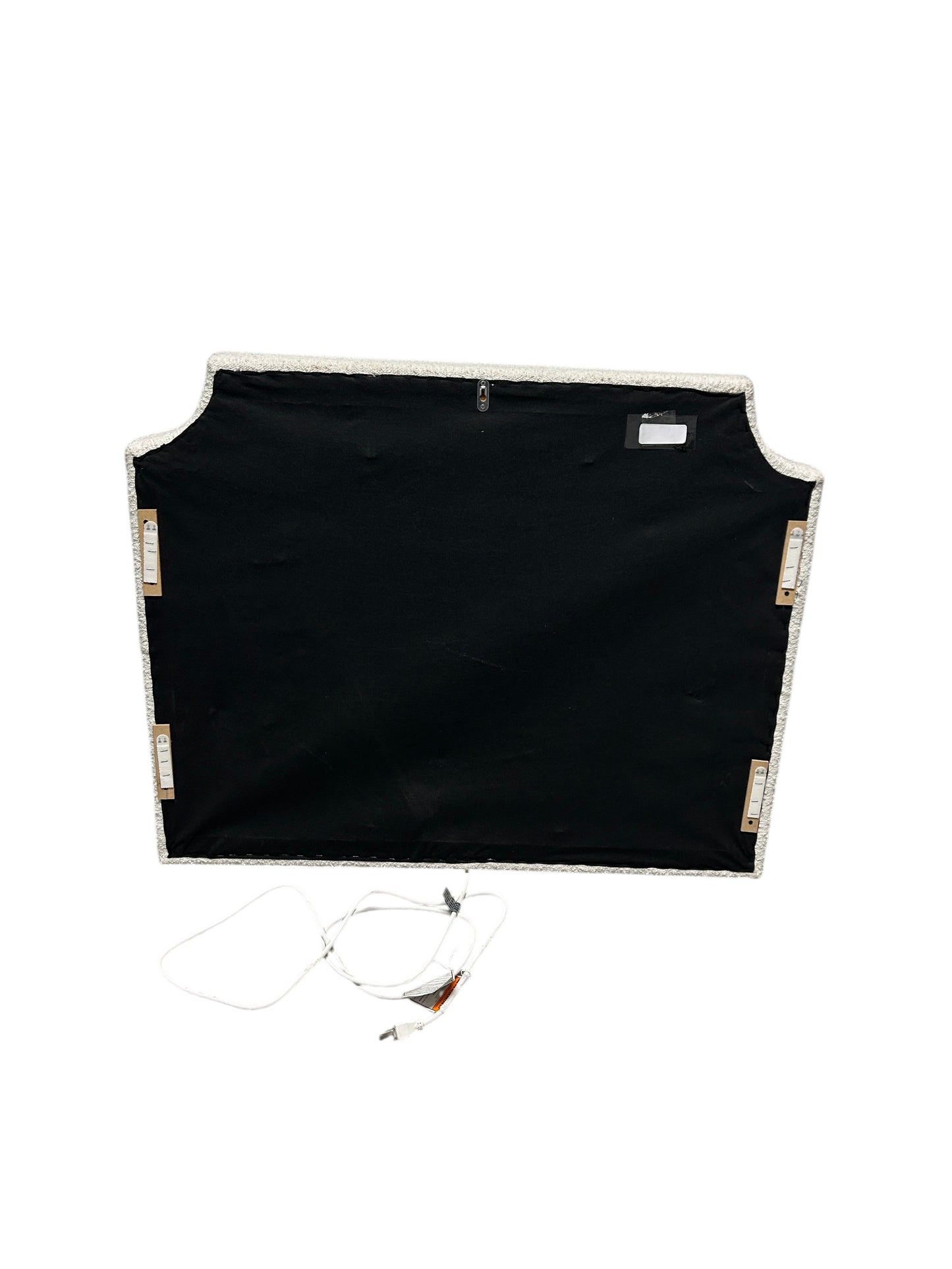 Dormify white twin headboard with bouclé fabric and a charging outlet.