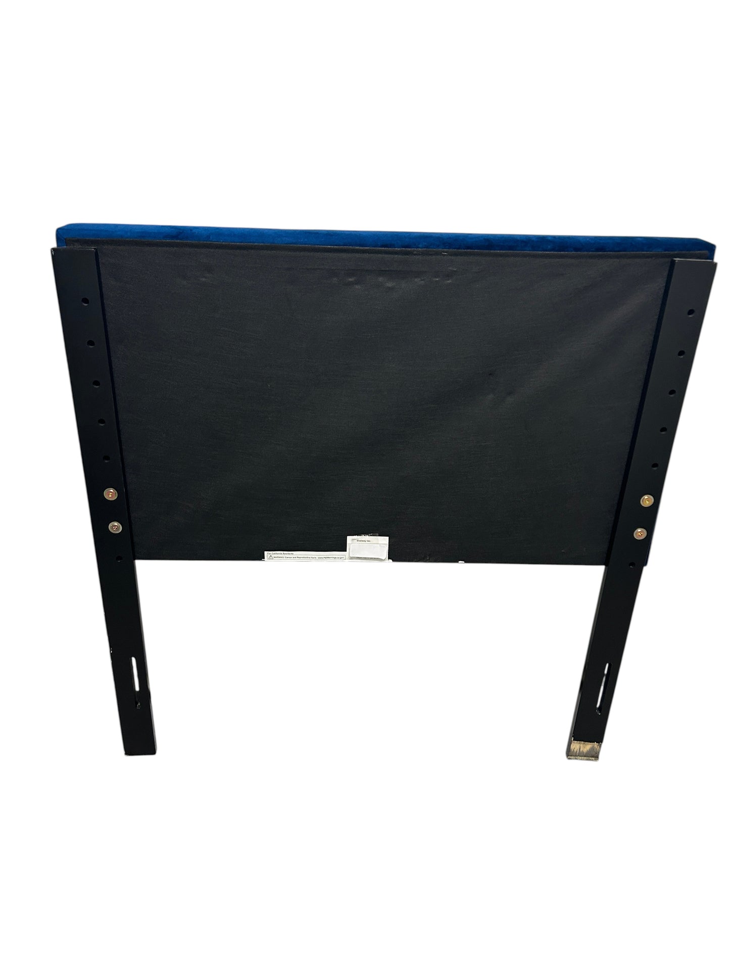 Blue twin velvet headboard with black legs.