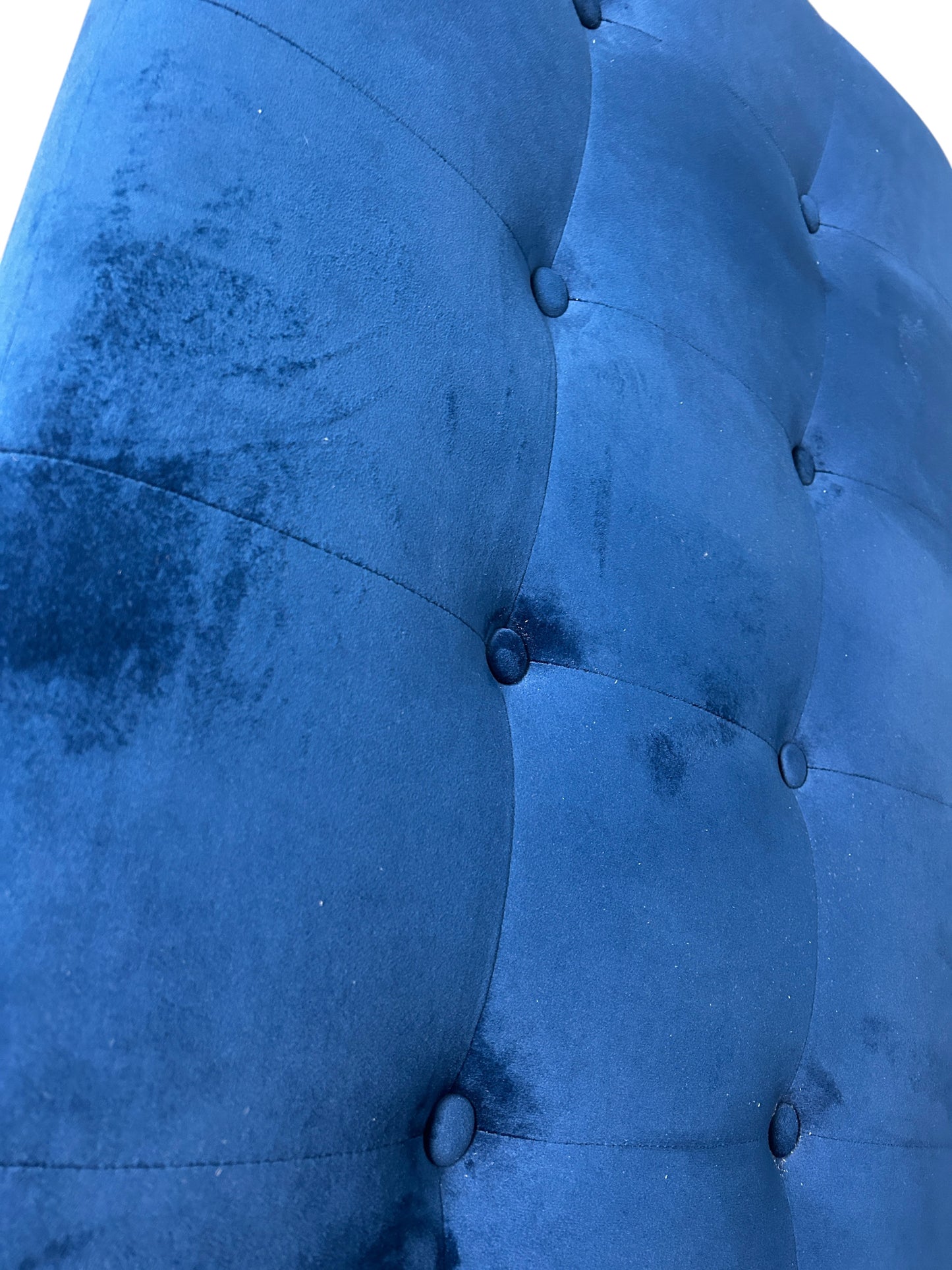 Blue twin velvet headboard with black legs.