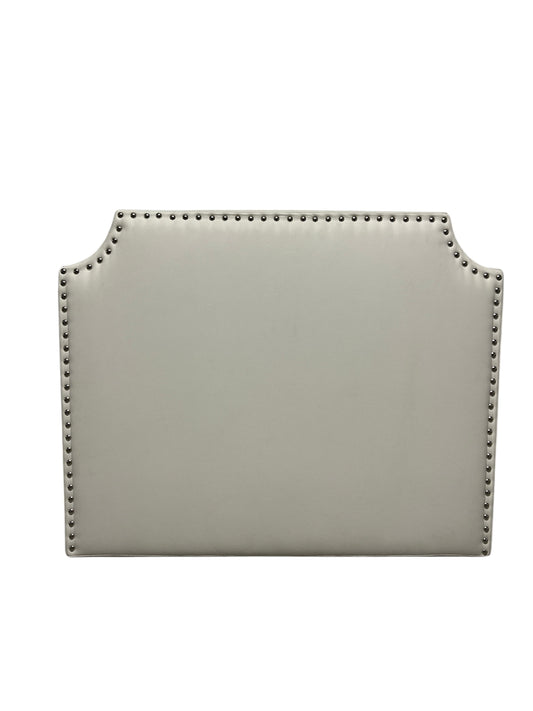 White twin headboard with silver buttons and a charging outlet.