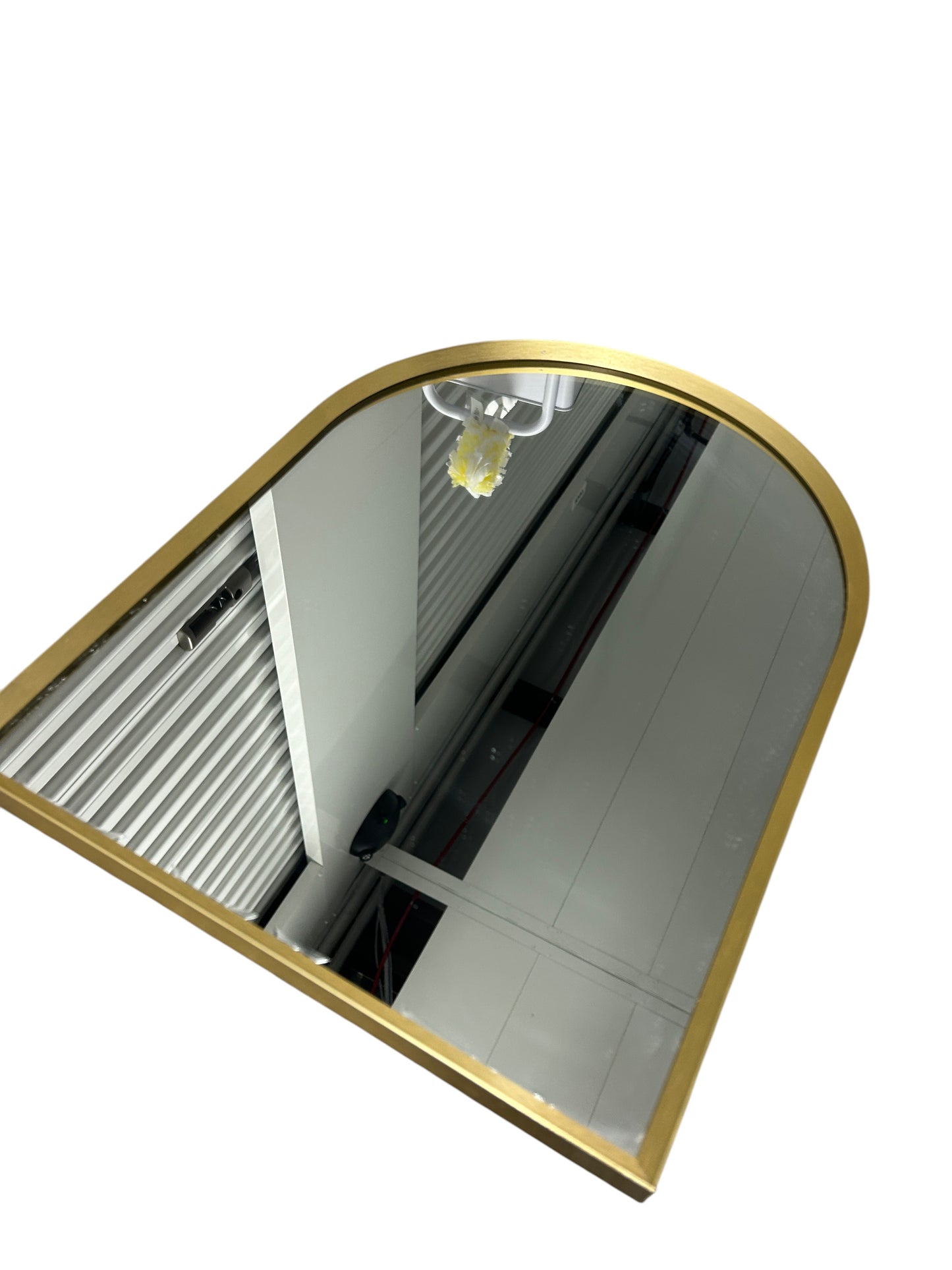 Gold arched mirror.