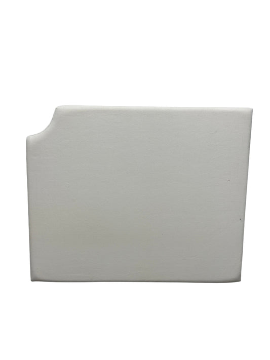 Cream velvet twin headboard with a notched corner.