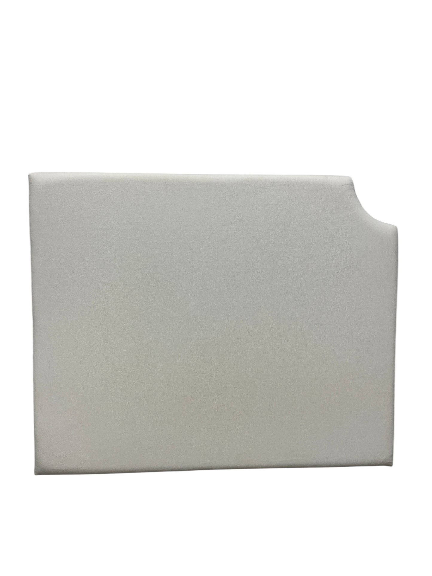 Cream velvet twin headboard with a notched corner.
