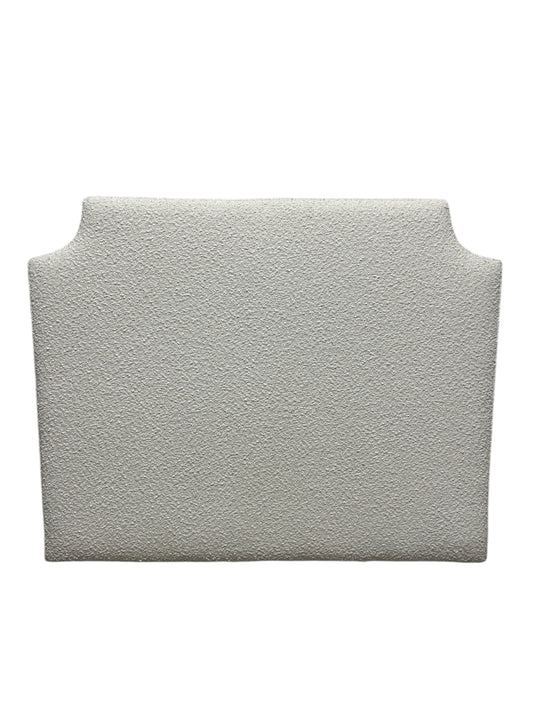 White twin headboard with bouclé fabric and a charging outlet.