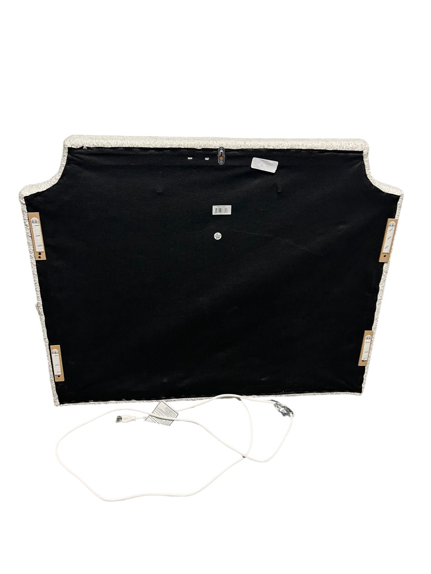 White twin headboard with bouclé fabric and a charging outlet.