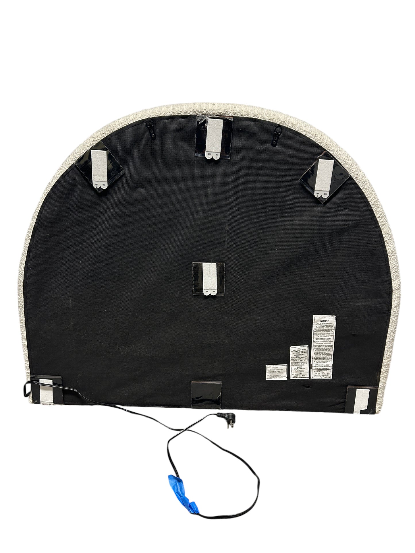 White twin headboard with bouclé fabric and a charging outlet.