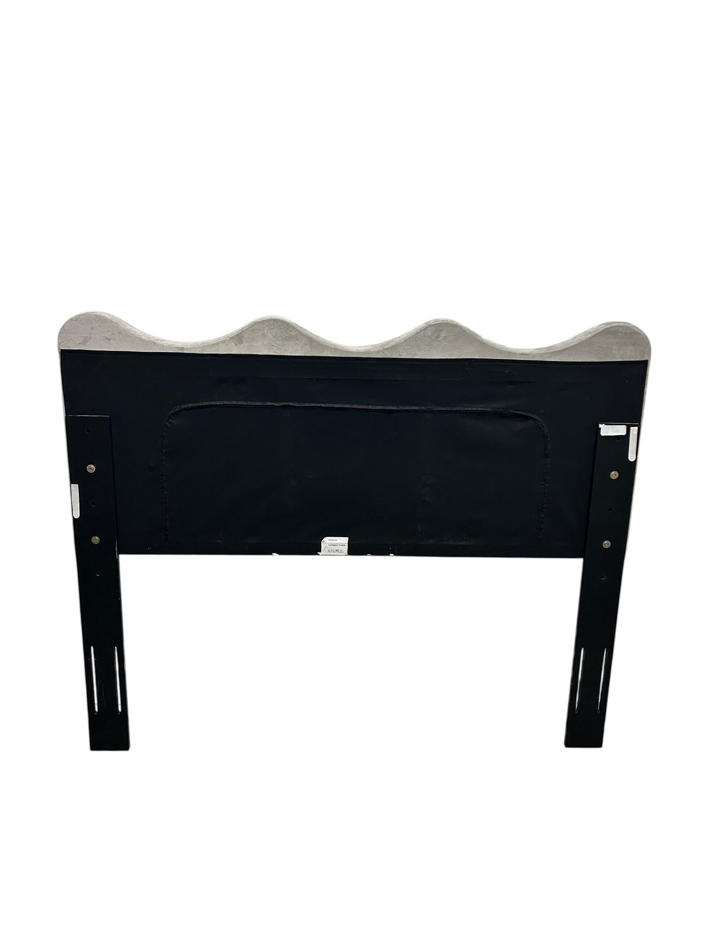 Gray queen velvet headboard with black wooden legs.