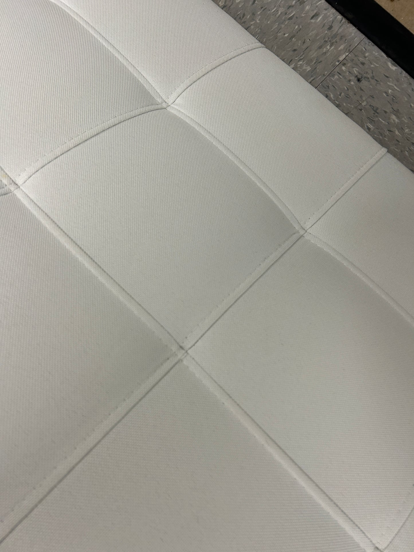 White rectangular twin headboard.