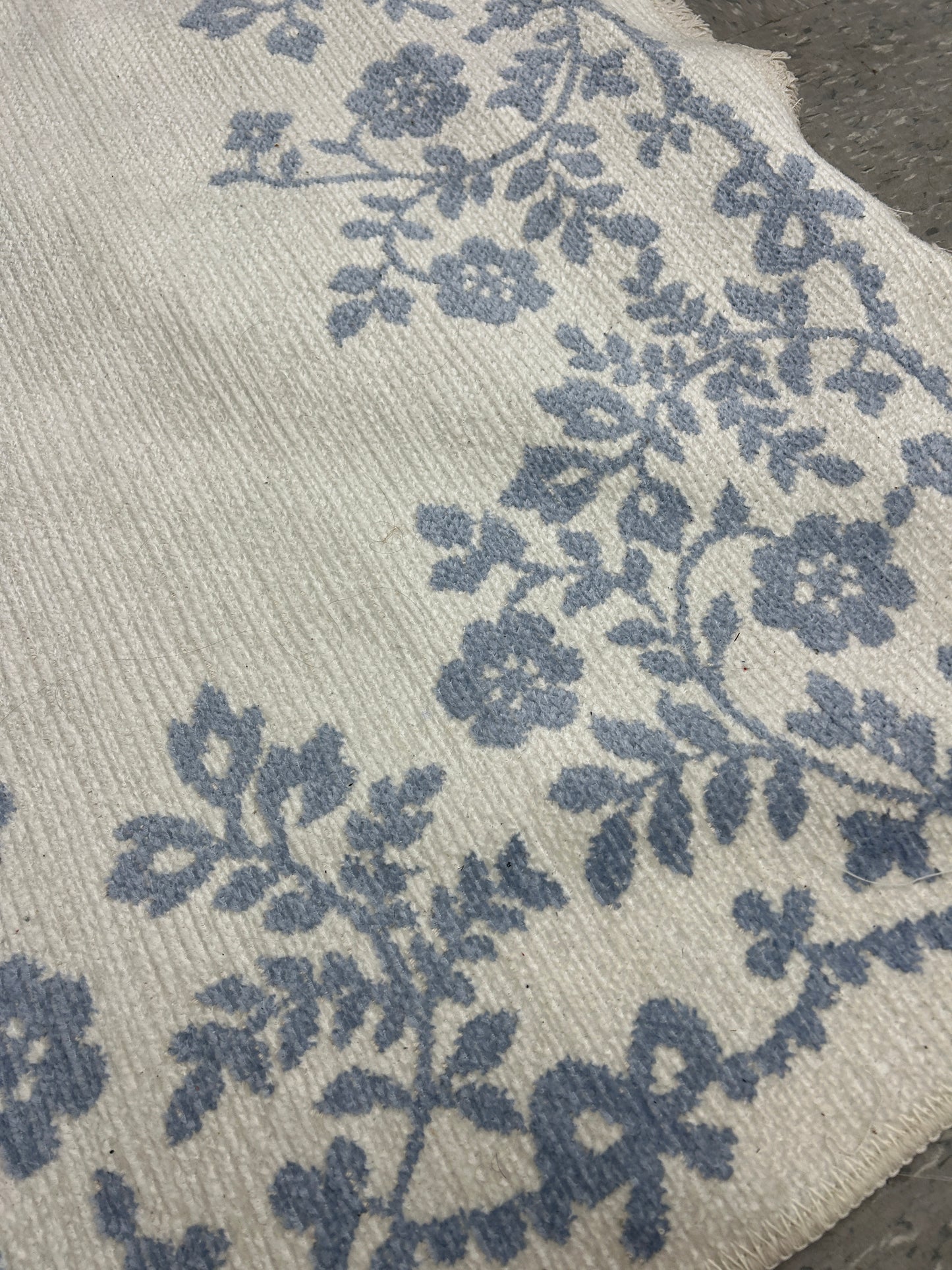 Pottery Barn Teen x LoveShackFancy blue and white reversible washable rug.